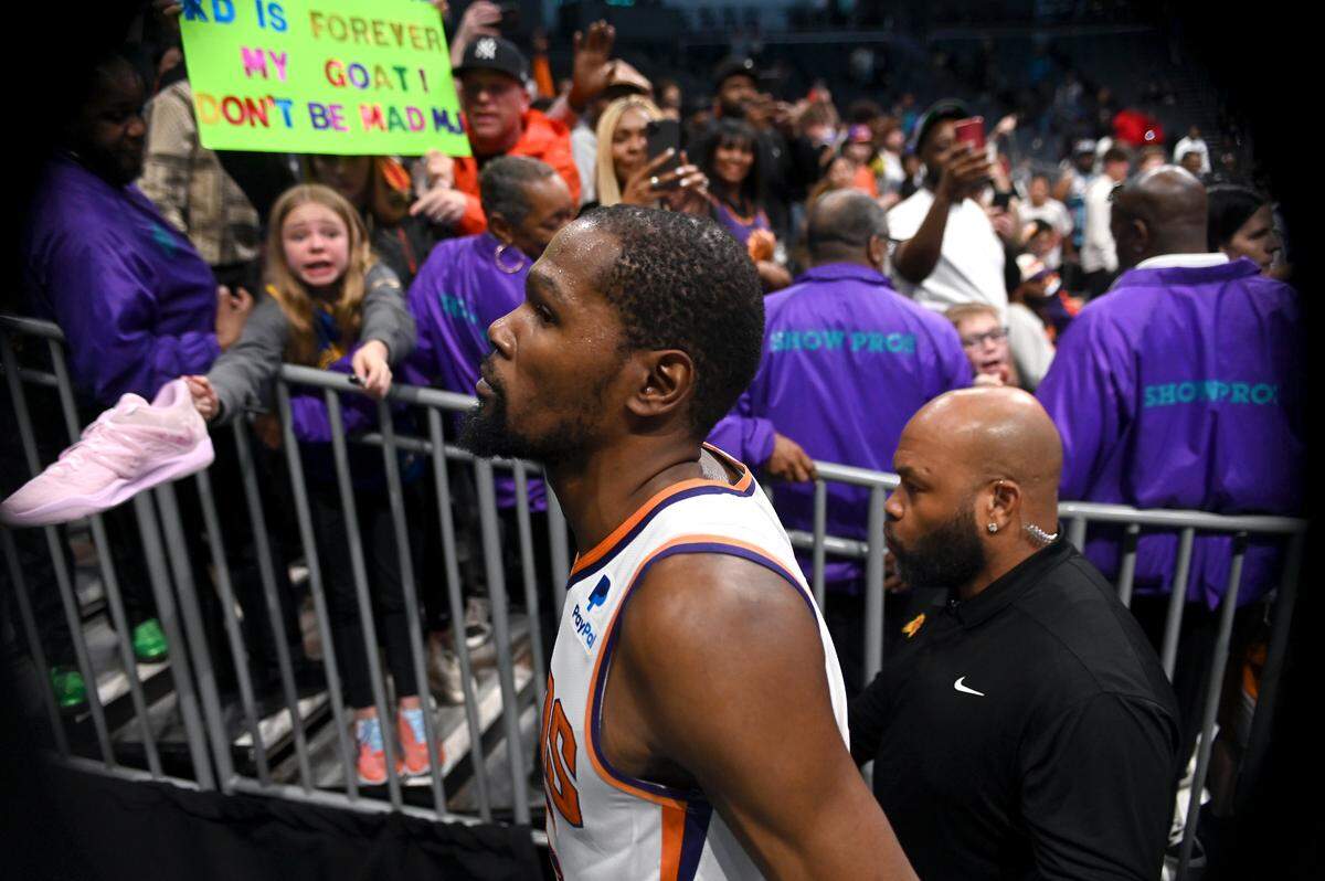 Phoenix Suns forward Kevin Durant walks past the fans following the team’s game against the Charlotte Hornets at Spectrum Center on Wednesday, March 1, 2023.