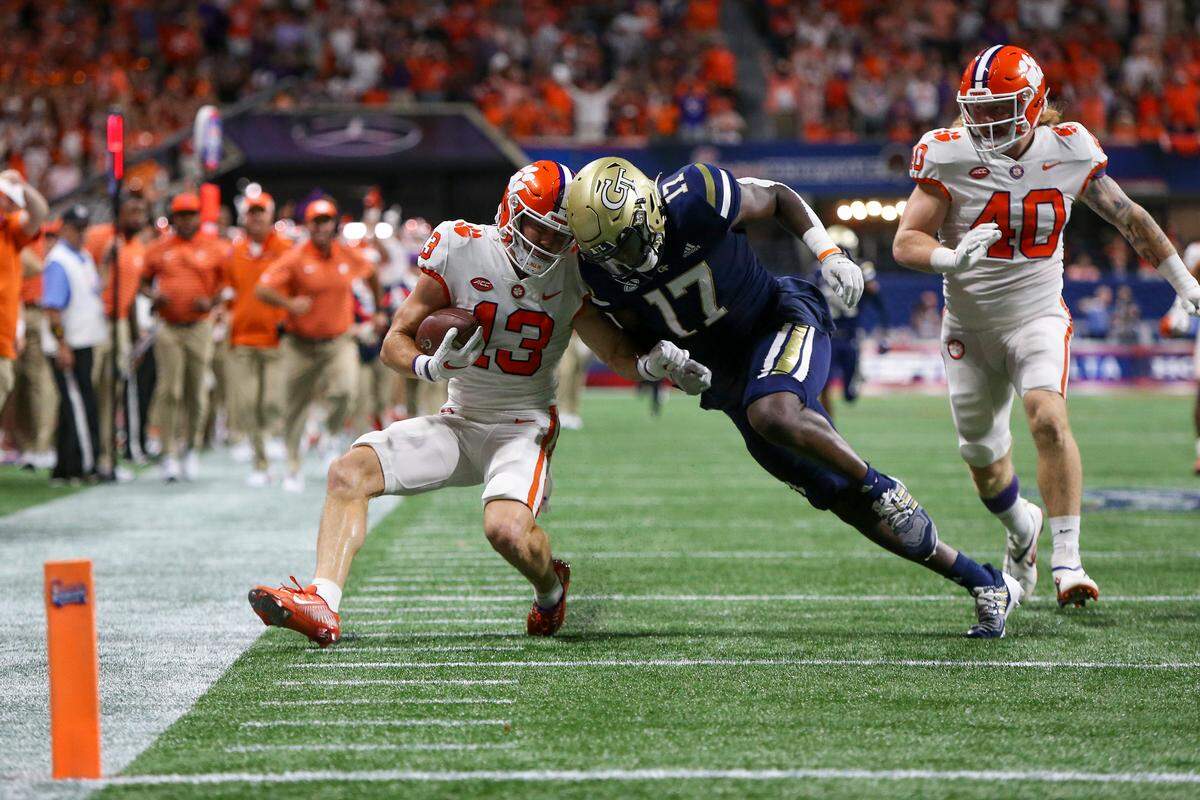 Clemson Tigers wide receiver Brannon Spector (13) is tackled by Georgia Tech Yellow Jackets linebacker Demetrius Knight II (17) in a 2022 game. Brett Davis-USA TODAY Sports