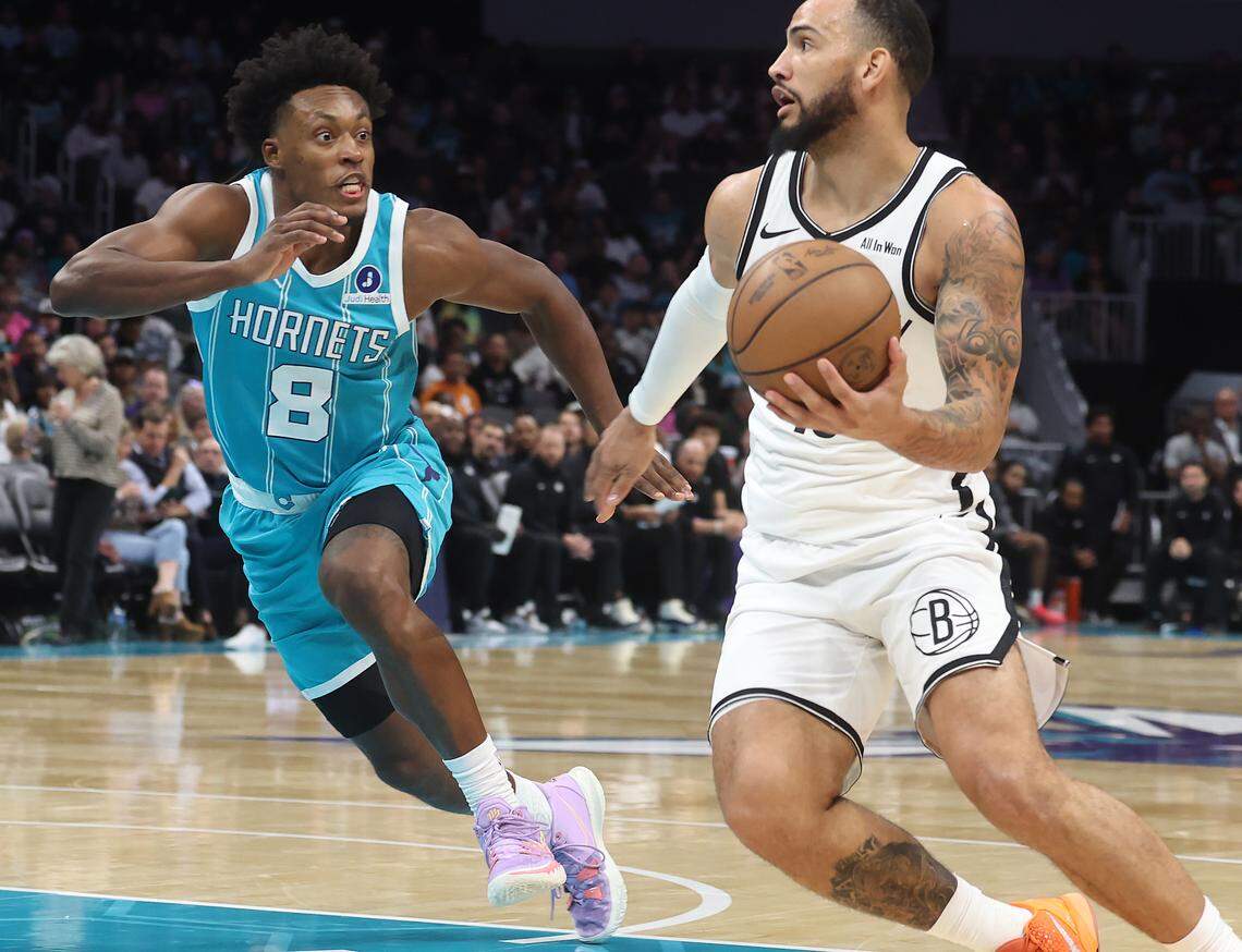 Charlotte Hornets guard Collin Sexton, left, guards Brooklyn Nets forward Tyrese Martin during action on Wednesday at Spectrum Center. The Hornets defeated the Nets, 136-117.