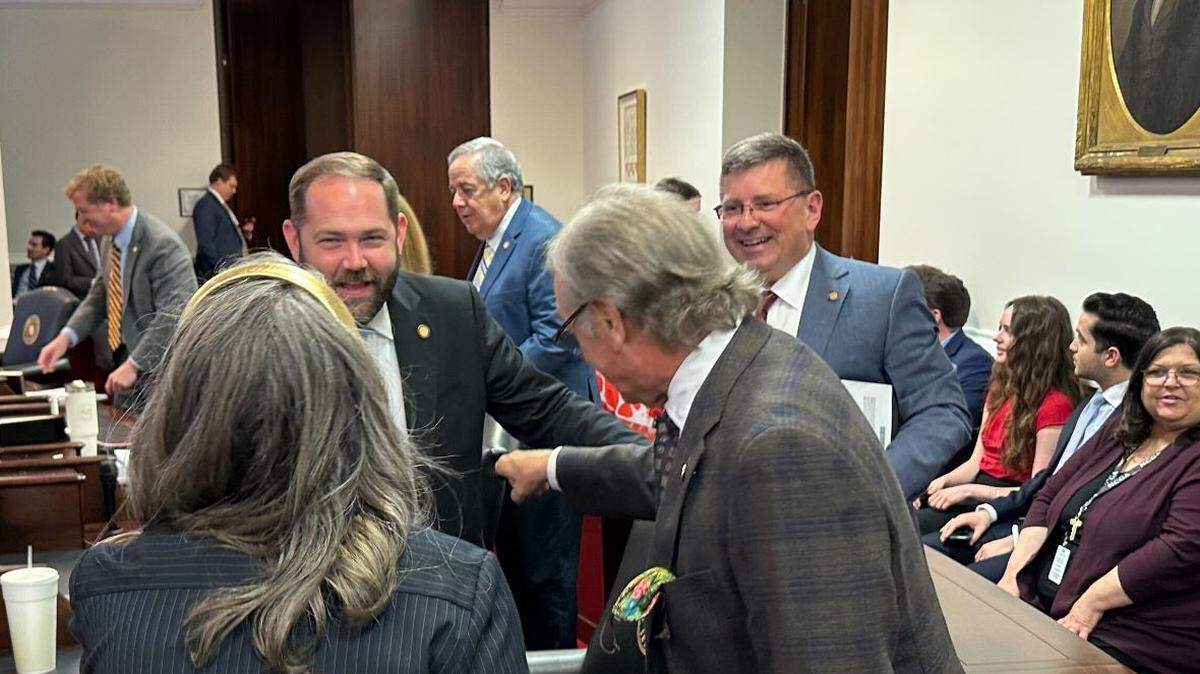 Sen. Chris Measmer of Cabarrus County chats with Senate Rules Chair Bill Rabon and Durham Sen. Sophia Chitlik after being sworn into office on Tuesday, April 15, 2025 to serve the remainder of former Sen. Paul Newton’s term.