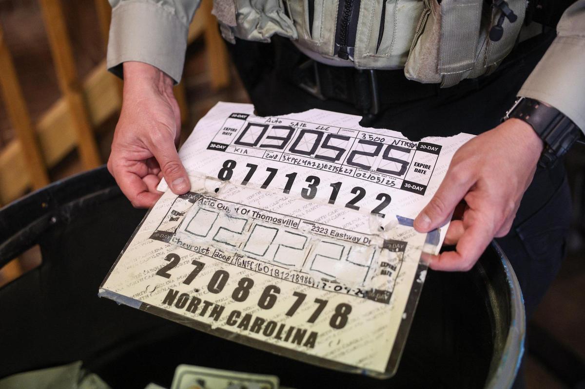 Two forged temporary license plates are compared. One had been whited-out as an obvious sign of a fake temporary license plate.