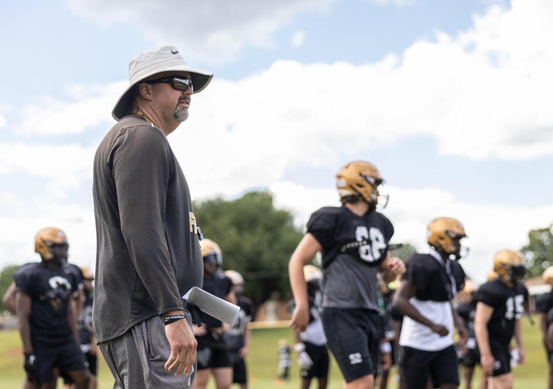 Coach Mike Wilbanks coaches during football practice at Shelby High School.