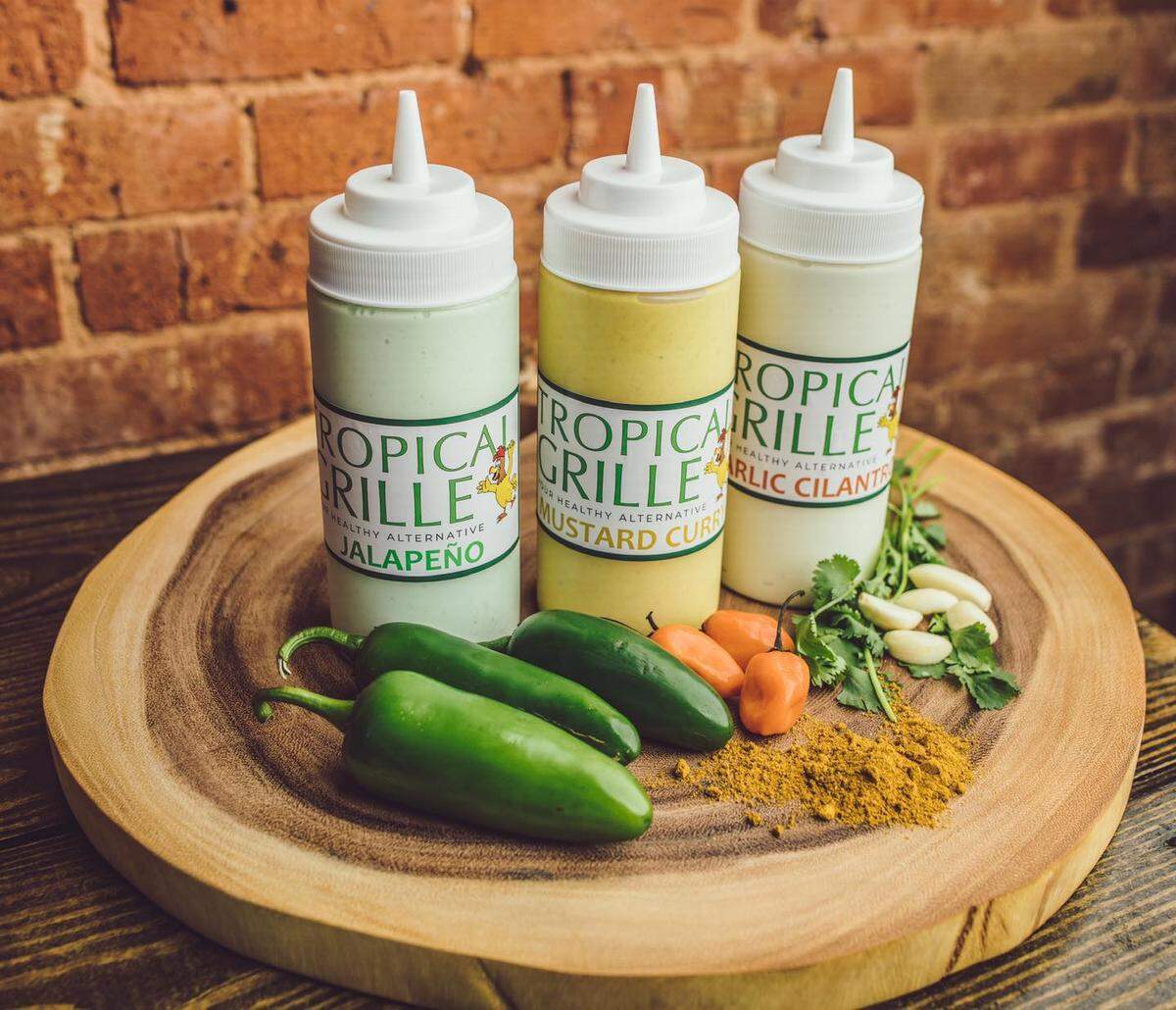 Cuban restaurant Tropical Grille is known for its house-made sauces: garlic cilantro, sweet mustard curry and jalapeno garlic.