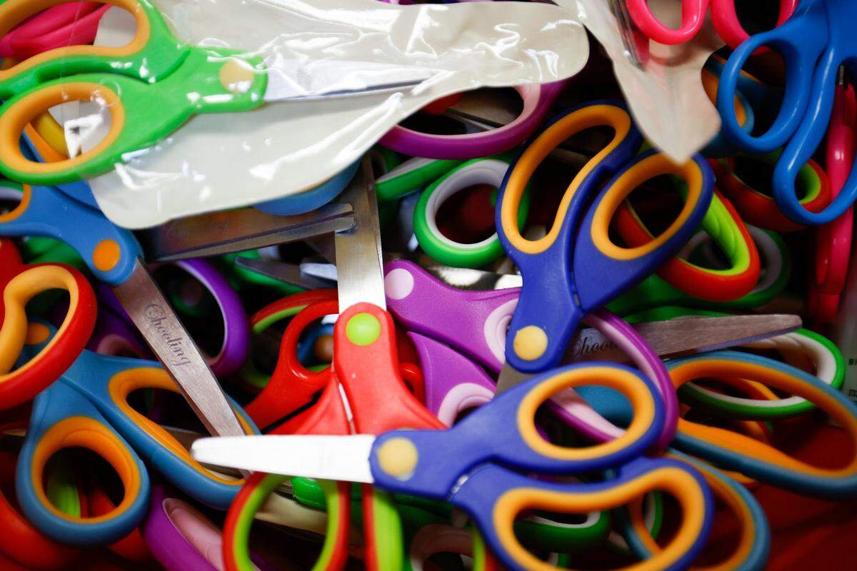 Scissors sit in a bin at Pineville Neighbors Place in Pineville, N.C., Tuesday, Aug. 9, 2022.