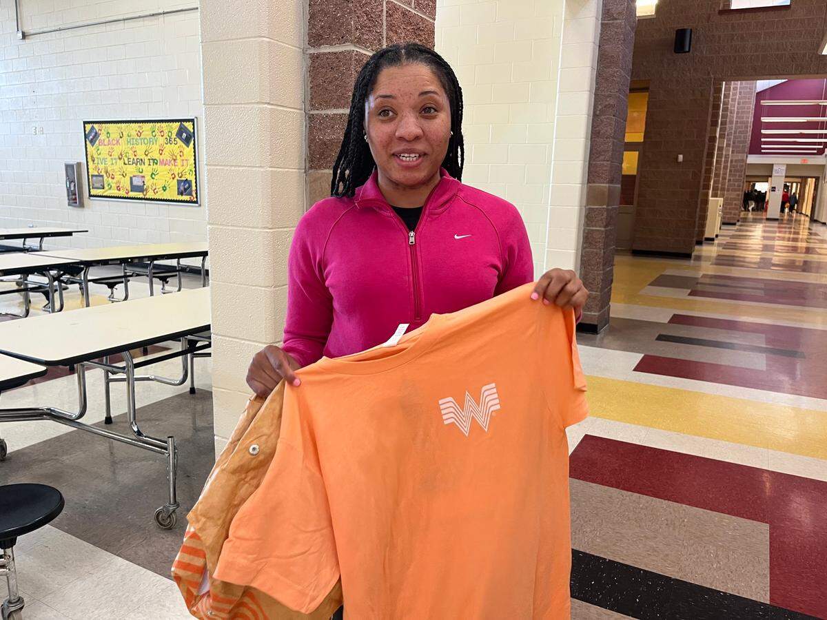 Ridge Road Middle School dance teacher Marissa Duff shows off her new Whataburger T-shirt.
