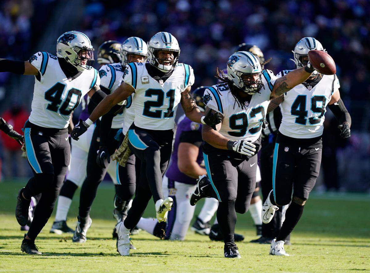 Carolina Panthers defensive tackle Bravvion Roy (93) celebrates an interception in the first half of an NFL football game against the Baltimore Ravens Sunday, Nov. 20, 2022, in Baltimore. (AP Photo/Nick Wass)