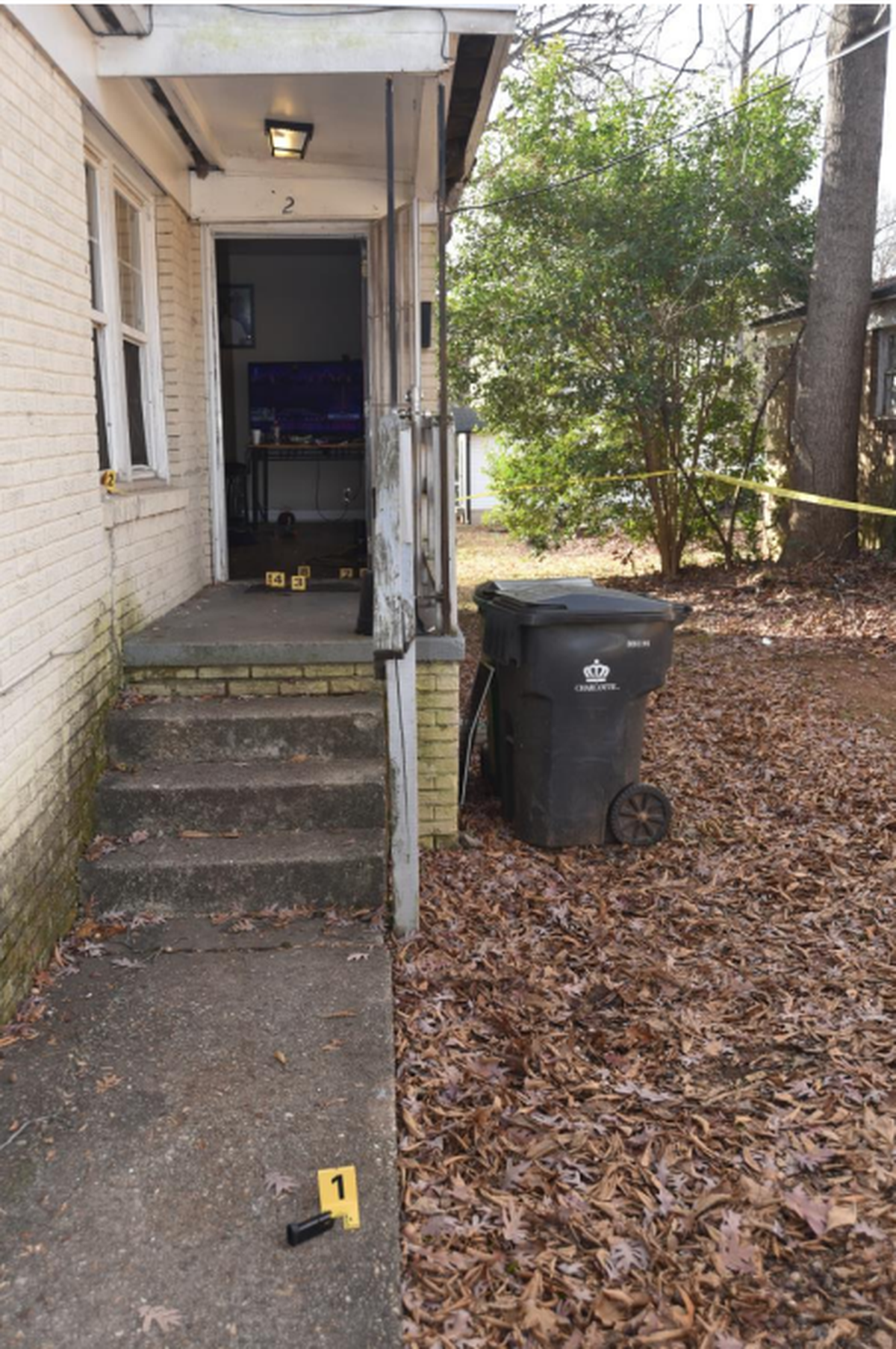The entrance to Sanrico McGill’s residence, where he died, as seen in a photo in the district attorney’s 2024 report on the shooting by CMPD.
