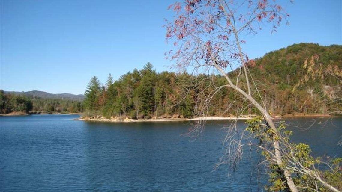 A Pickens County woman told deputies she was kidnapped from outside her home and eventually pushed into Lake Keowee on Sunday.