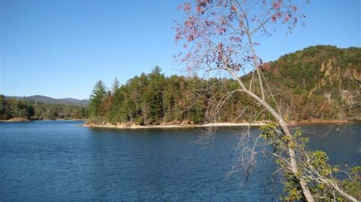 A Pickens County woman told deputies she was kidnapped from outside her home and eventually pushed into Lake Keowee on Sunday.