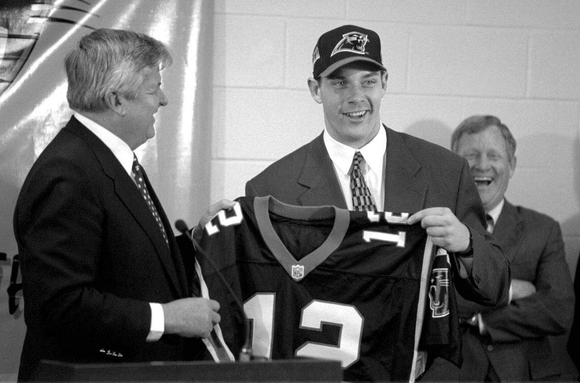 In April 1995, team owner Jerry Richardson (left), quarterback Kerry Collins and general manager Bill Polian were all smiles. Polian said in his “Sports Legends” interview that he and Richardson “weren’t in alignment” on how to rebuild the team after the defense started aging in the late 1990s, which helped cause Polian’s departure for Indianapolis.