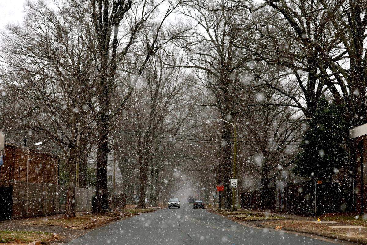 Snow starts to fall along North Graham St. in Charlotte on Wednesday, Feb. 19, 2025.