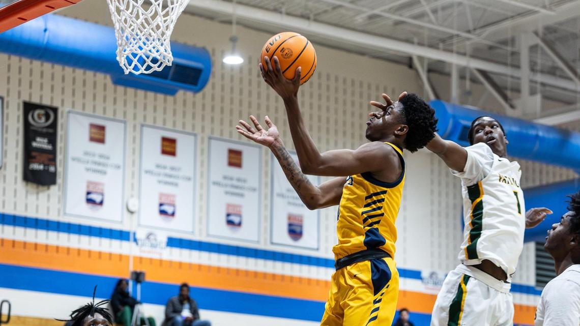Lancaster Bruins Jordan Watford, left, shoots past a block by Independence Patriots Lusemo Macharia during the Phenom Hoops New Year’s Bash at Marvin Ridge High School in Waxhaw, N.C., on Friday, December 27, 2024.