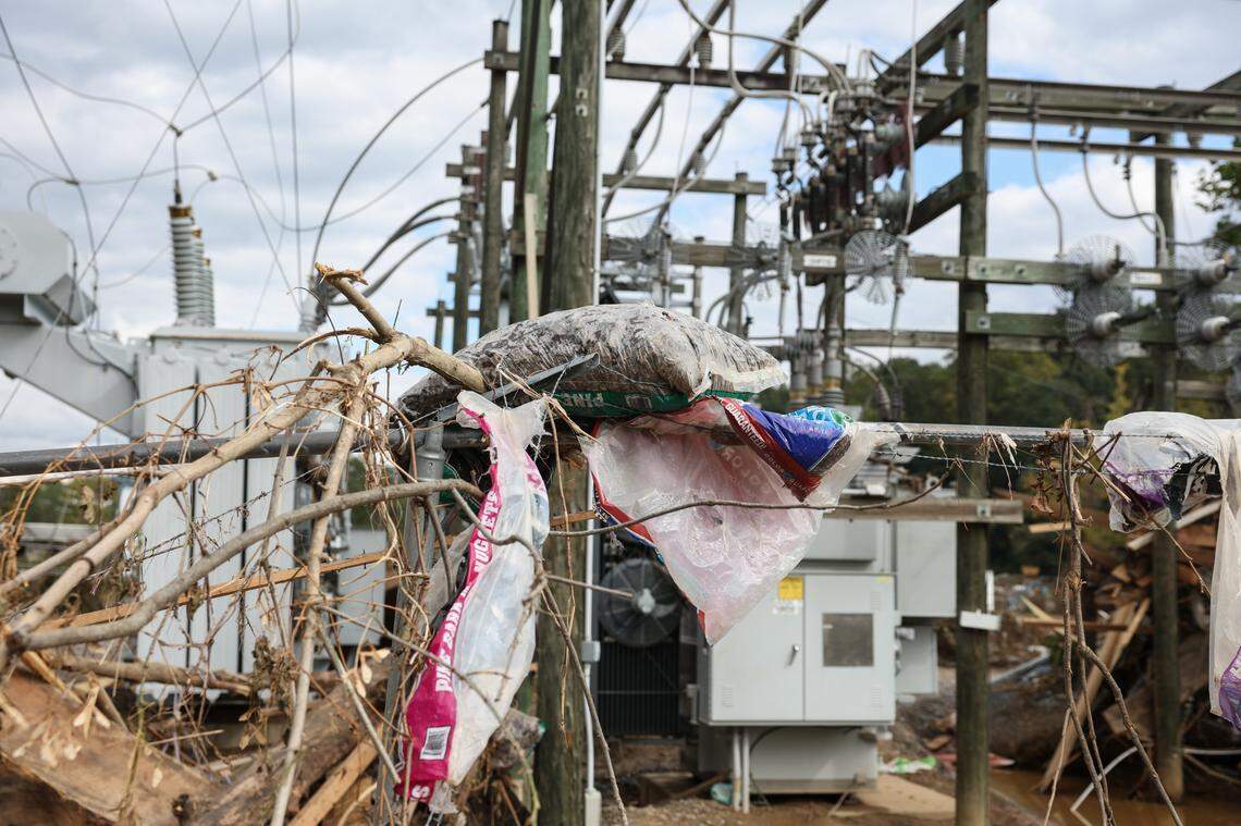 A Duke Energy substation is littered with items from a Lowe’s home improvement center that is located less than a mile upstream from its location along the Swannaoa River. Items from the store such as bags of mulch, lumber, plastic tubing and bags of flower bulbs were carried in the flood waters caused by Hurricane Helene.