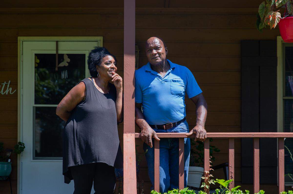 Eunice Hill and Sylvester Hill Sr. on the porch of their family home at the Hill Family Farm in Edgecombe County, N.C., August 30, 2020. The couple run the Hill Family Farm, a self-proclaimed hub of the community where people can hang out with animals, pick herbs and fresh fruit, visit beehives, check out several aircrafts, race cars and cook meals together.