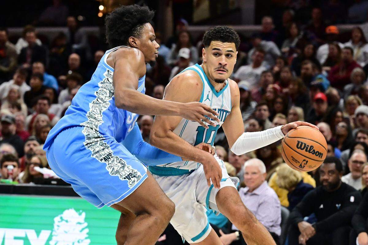 Charlotte Hornets guard Josh Green (10) drives to the basket against Cleveland Cavaliers forward Isaac Okoro (35) during the first half at Rocket Mortgage FieldHouse.