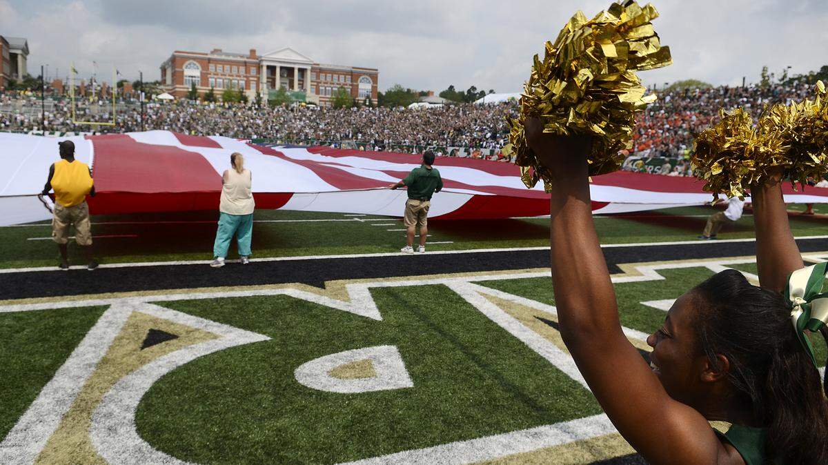 A giant American flag was brought onto the field prior to the game Saturday. The Charlotte 49ers stormed out to an early lead and pushed it to a 35-7 advantage at halftime over the Campbell Camels Saturday .