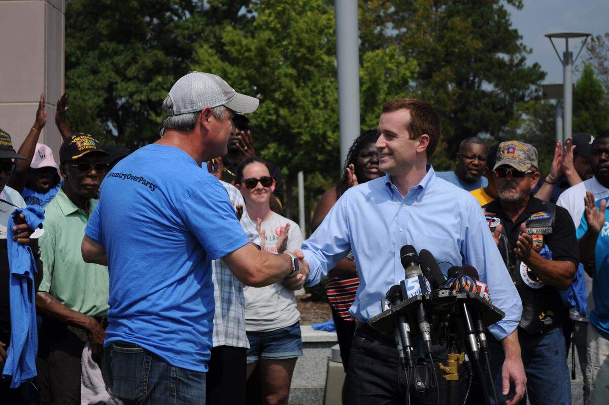 Dan McCready greets Democratic State Sen. Kirk deViere in Fayetteville.