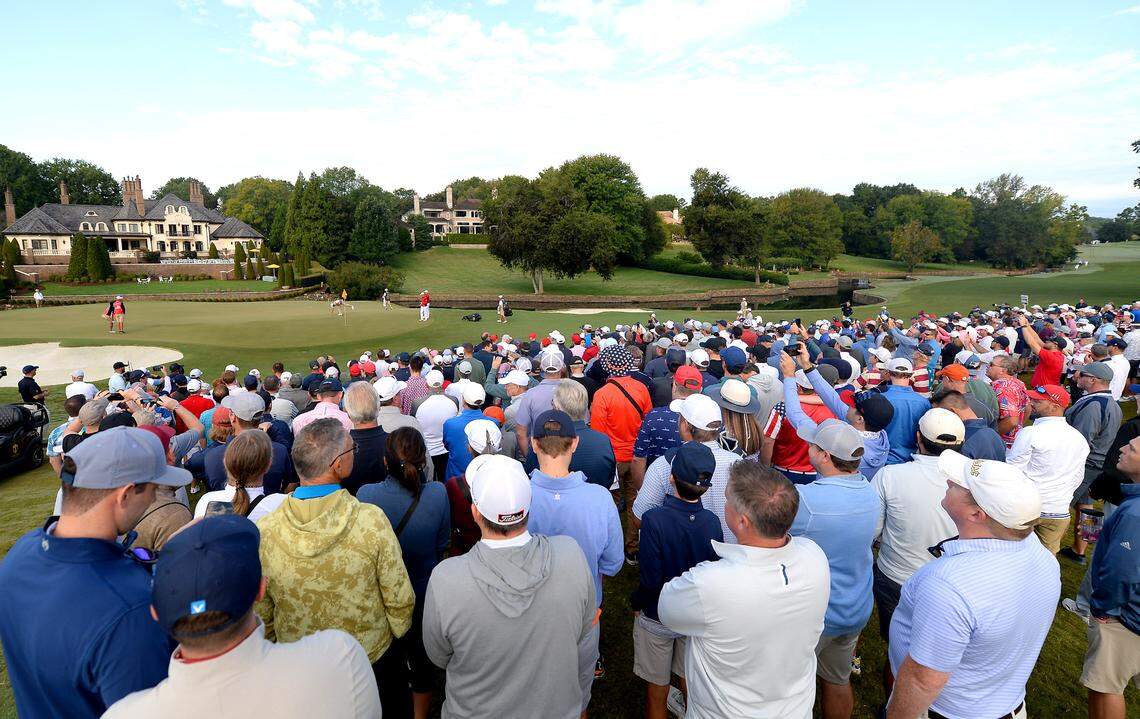 Presidents Cup patrons stand along the seventh fairway at Quail Hollow Club in Charlotte, NC watching United States and International Team members play on Saturday, September 24, 2022.