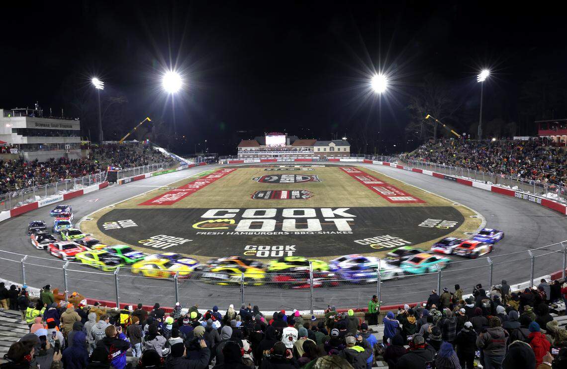 The field in the Cookout Clash blur through Turns 1 and 2 at Bowman Gray Stadium in Winston-Salem, NC on Wednesday, Feb. 4, 2026. NASCAR Cup Series driver Ryan Preece would win the race.