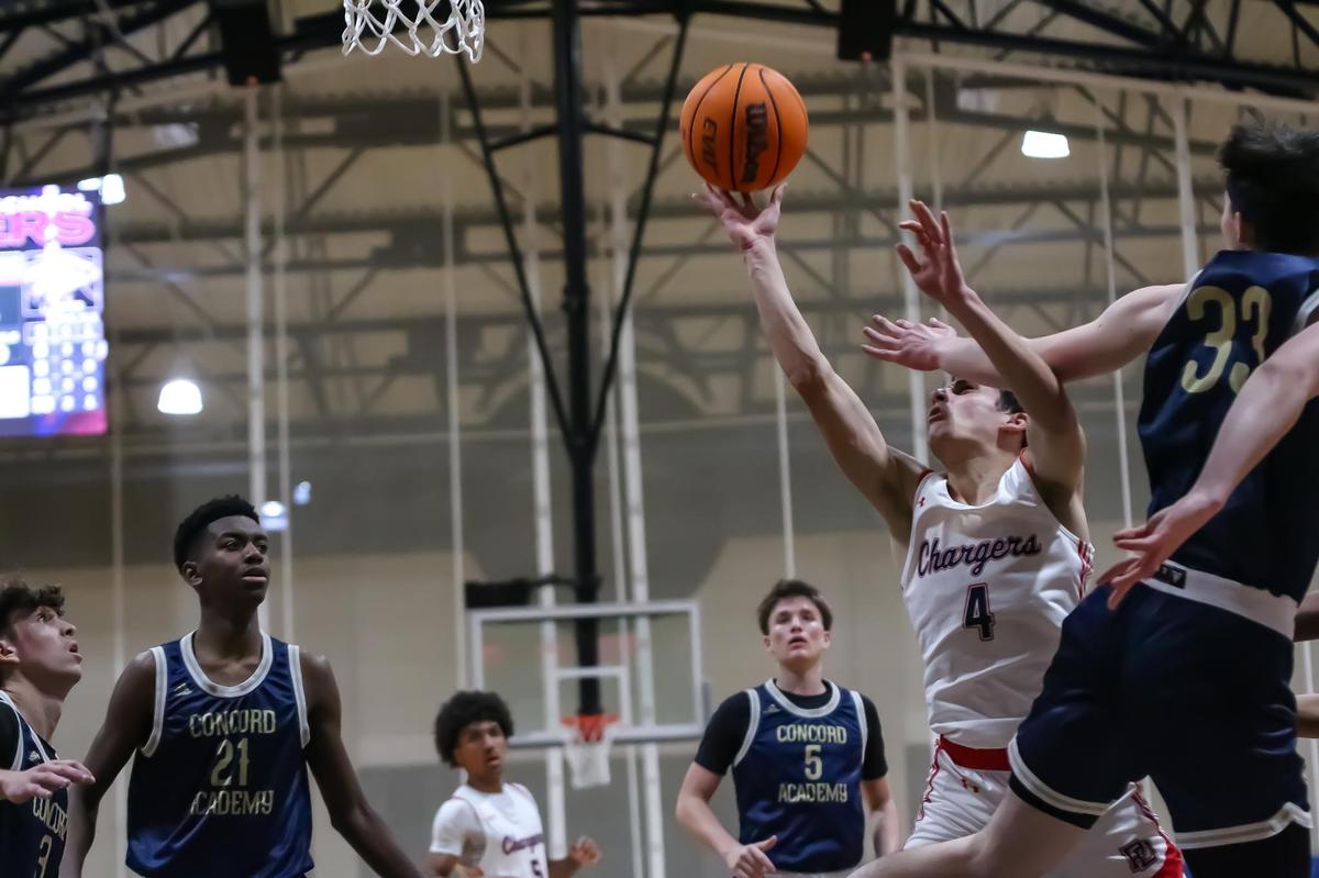 Providence Day Sean Dunn powers through Concords defense to score two at the Concord Academy and Providence Day game at Providence Day high school on Dec 14th, 2024