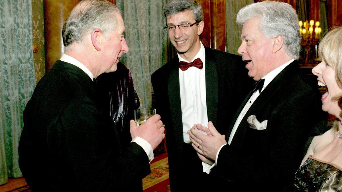 Christopher Warren-Green, right, chatted with then-Prince Charles, now the king after Queen Elizabeth II’s death Thursday, at a Buckingham Palace reception in 2011. Warren-Green’s wife, Rosemary Furniss, is at far right.
