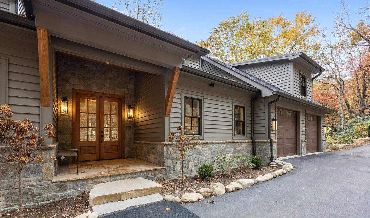 The first floor of the home includes a double door entry with views straight through to the lake.