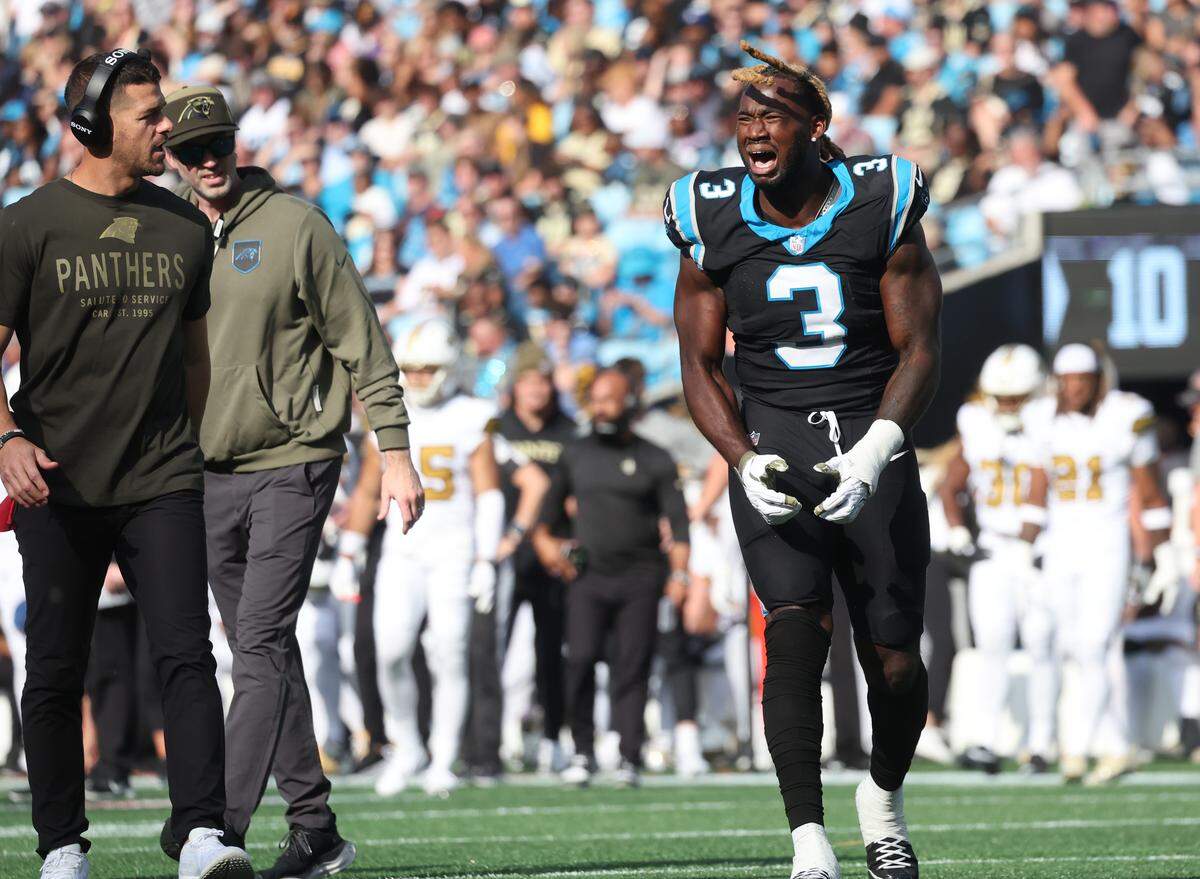 Carolina Panthers Princely Umanmielen reacts as coach Dave Canales walks alongside him on Sunday, Nov. 9, 2025, at Bank of America Stadium in Charlotte.