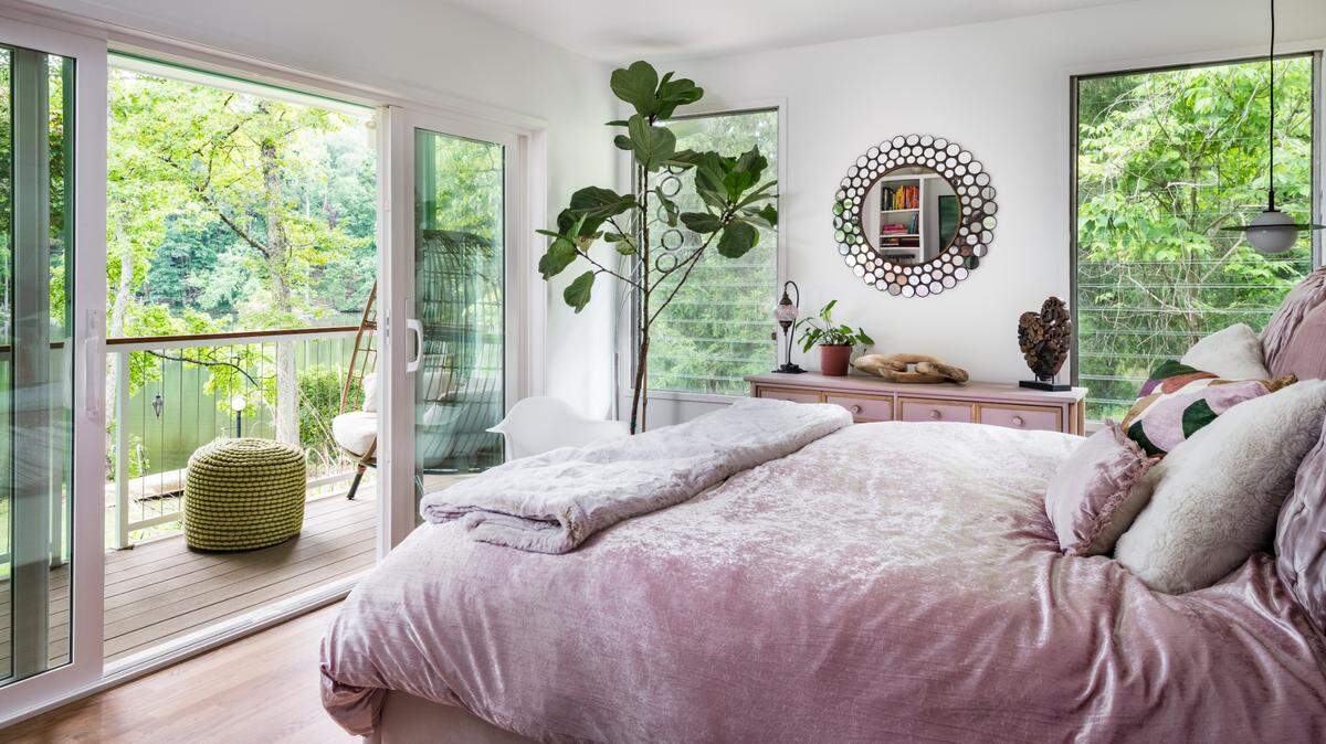 The primary bedroom at Heather Harjes’ home opens up to a lake that’s private to the neighborhood.