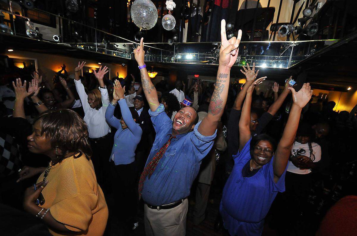 President Barack Obama supporters cheer and rejoice after he was  elected for a second term. They celebrated the election returns at the Excelsior Club.T. Ortega Gaines -ogaines@charlotteobserver.con