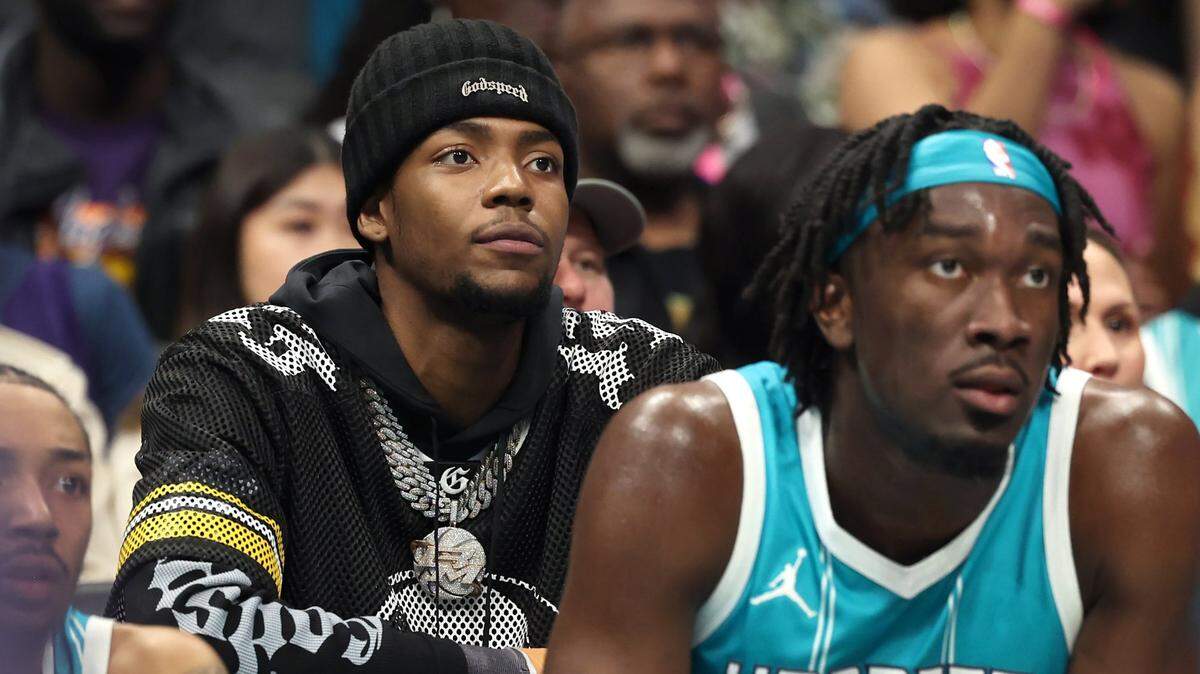 Injured Charlotte Hornets forward Brandon Miller, left, sits behind center Mark Williams, right, during the team’s game against the Los Angeles Lakers at Spectrum Center in Charlotte, NC on Monday, January 27, 2025. The Lakers defeated the Hornets 112-107.