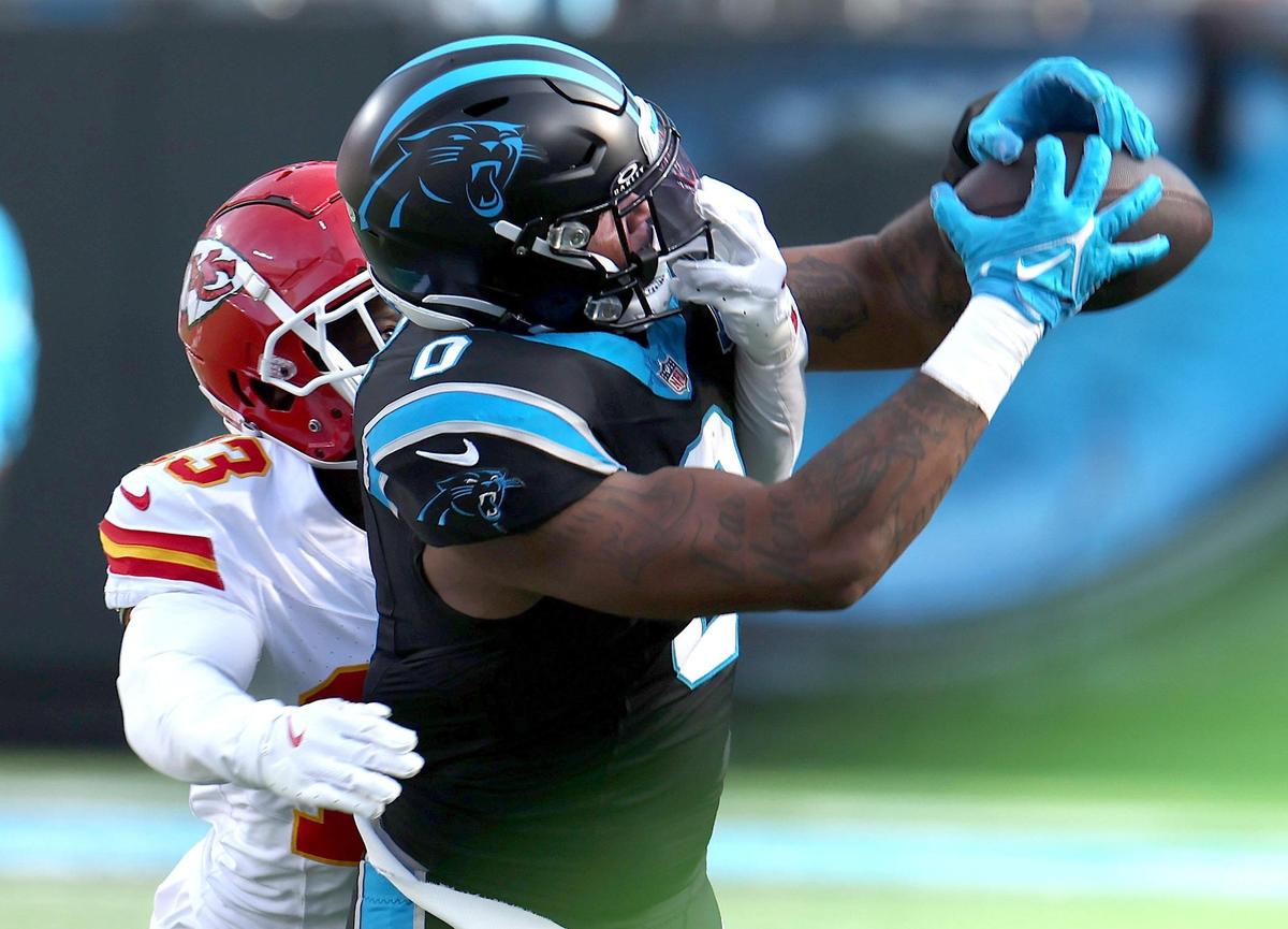 Carolina Panthers wide receiver Ja’Tavion Sanders, right, catches a pass along the sideline as Kansas City Chiefs cornerback Nazeeh Johnson, left, attempts to knock the pass away at Bank of America Stadium in Charlotte, NC on Sunday, November 24, 2024.