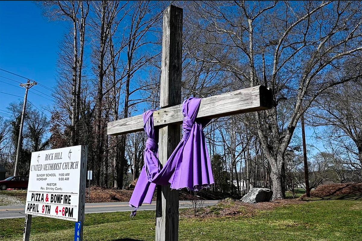 A cross stands on the lawn of Rock Hill Methodist Church on Sunday, March 28, 2022 in Stanley, NC.