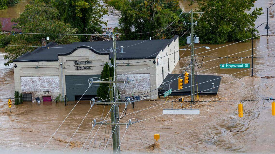Flooding on the French Broad River in the River Arts District in Asheville on Friday, Sept. 27, 2024 as the remnants of Hurricane Helene caused flooding, downed trees, and power outages in western North Carolina.