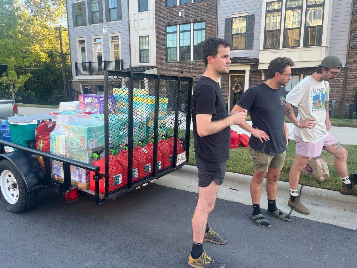 From left, Porter Watson, Shane Shields and friends gather supplies to bring back to Western North Carolina. Both Watson and Shields have temporarily relocated to Charlotte to help lessen the burden on needed resources in Asheville and nearby areas.
