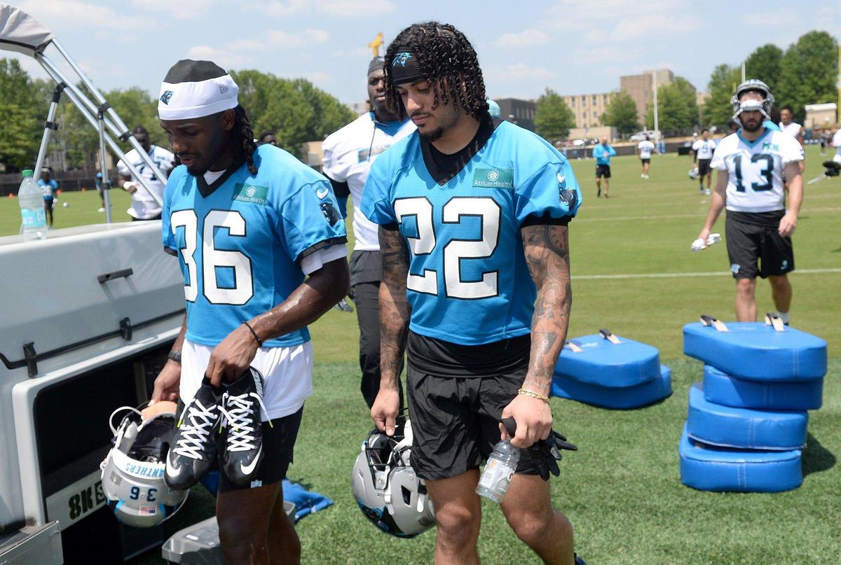 Demani Richardson, #36, and Lathan Ransom, #22, Panthers safeties, head to the locker room after practice.The Carolina Panthers, in their second week of organized team activities, ran through drills on Tuesday, June 3, 2025 at their practice facility in uptown Charlotte.