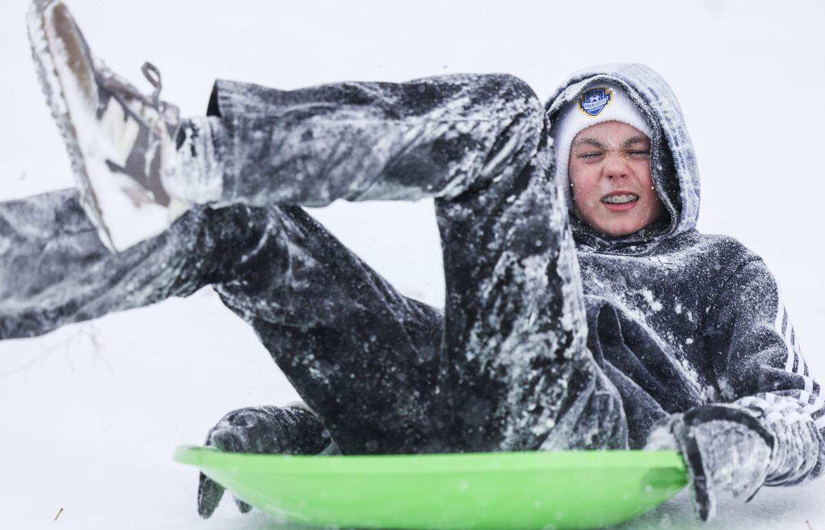 A boy sleds in Cordelia Park in Charlotte, N.C., on Saturday, January 31, 2026.