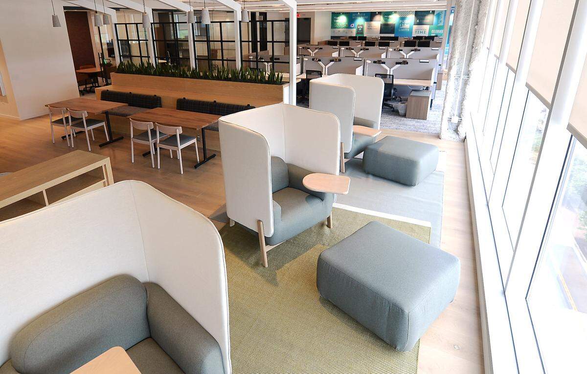 Pods with ottomans provide employees a workspace and privacy at the new LendingTree headquarters in South End.
