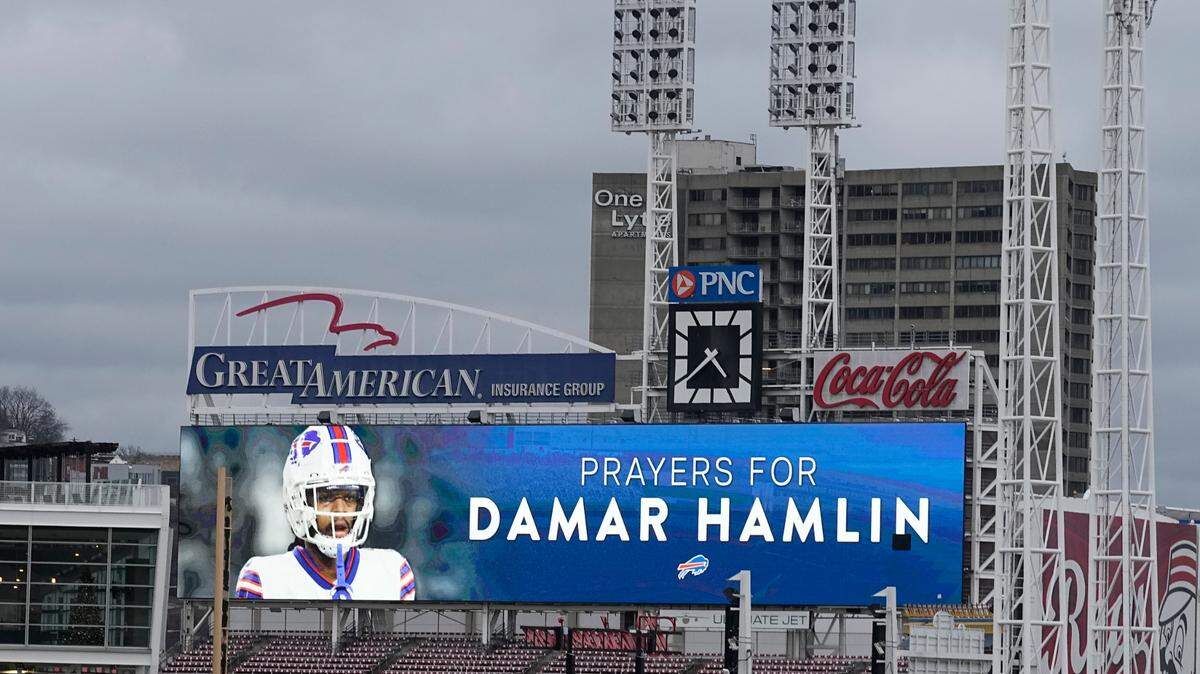 A scoreboard at Great American Ballpark displays a photo of Buffalo Bills’ Damar Hamlin, Tuesday, Jan. 3, 2023, in Cincinnati. Hamlin was taken to the University of Cincinnati Medical Center after collapsing on the field during an NFL football game against the Cincinnati Bengals on Monday night.