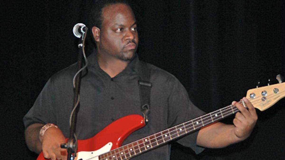 “All he wanted to do was play,” Letron Brantley said of his bandmate, Reggie Dennis. Dennis died Feb. 3 at 52.