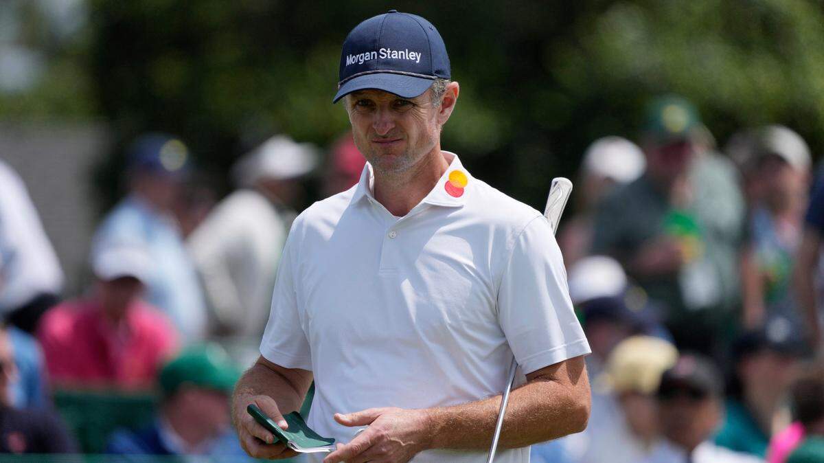 Justin Rose prepares to putt on the 18th green during the second round of the Masters Tournament at Augusta National Golf Club. 