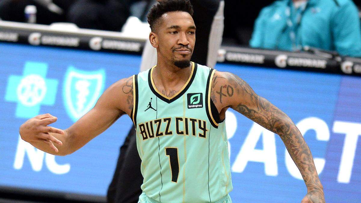 Charlotte Hornets guard Malik Monk celebrates a three-point basket against the Miami Heat during first half action on Friday, March 26, 2021 at Spectrum Center in Charlotte, NC. Monk had 24 points at the half.