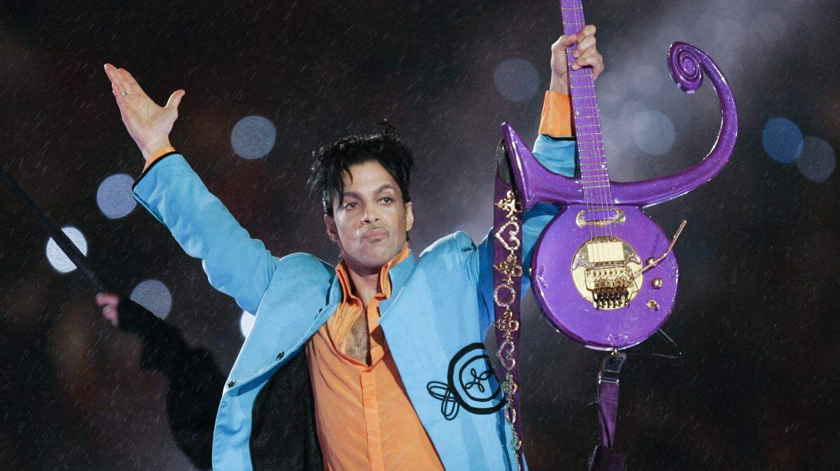 Prince waves to the crowd after his performance at halftime of the 2007 Super Bowl.