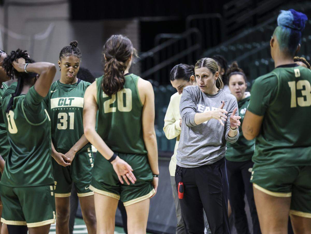 Charlotte 49ers coach Cara Consuegra coaches during practice at the Halton Arena at in Charlotte, N.C., on Wednesday, November 2, 2022.