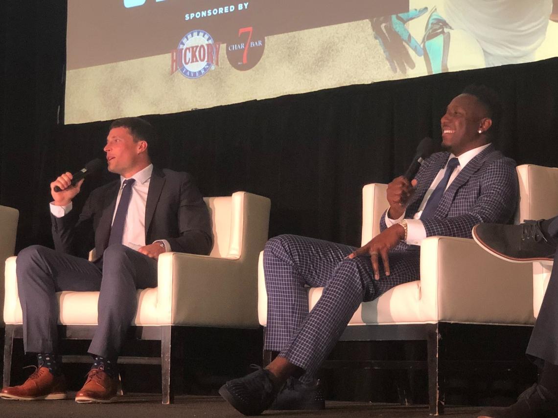 Thomas Davis and Luke Kuechly speaking at the Charlotte Touchdown Club luncheon.