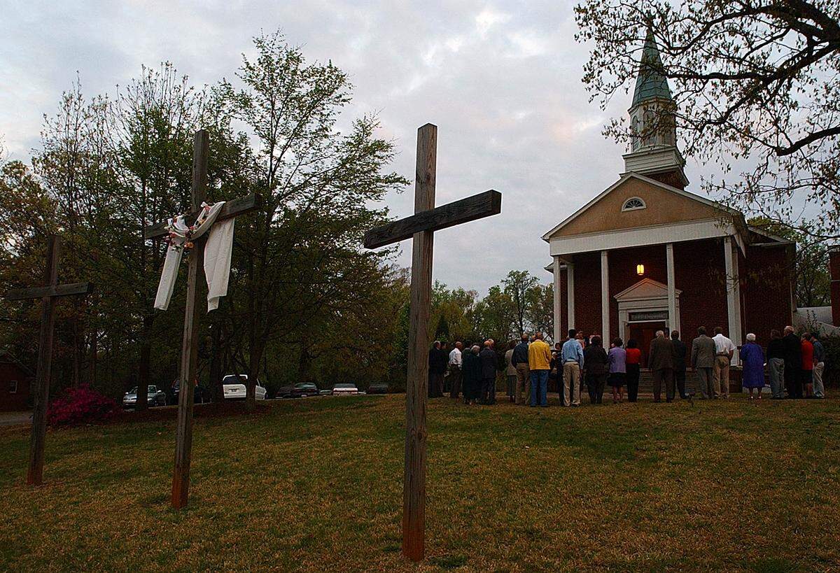 Worshipers gather outside of Big Spring United Methodist Church on Old Dowd Road to sing during an Easter Sunday sunrise service in April 2004. The church caught fire on Thursday, Sept. 30, 2021.