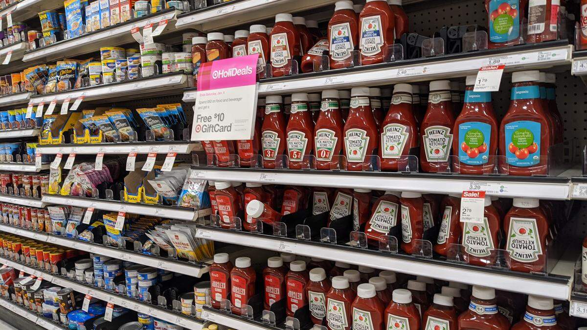 Which communities in Charlotte are located the farthest from grocery stores?