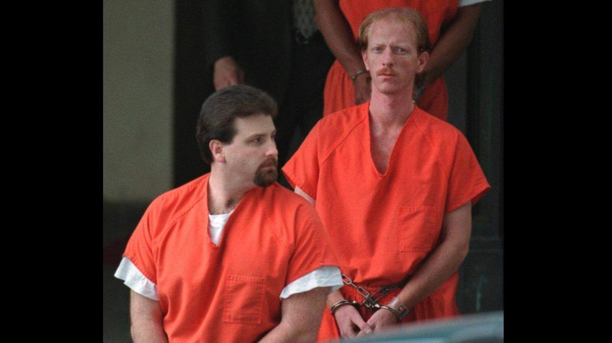 Loomis Fargo suspects Steven Chambers (left) and David Scott Ghantt leave federal court on April 23, 1998.