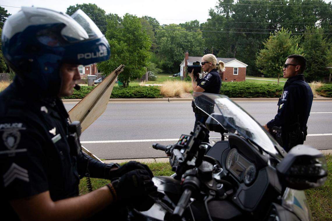 CMPD Sgt. Adam Jones, left, Officer Amanda Walters, center, and Officer Danny Leung check for motorists driving over the speed limit on Freedom Drive in Charlotte.