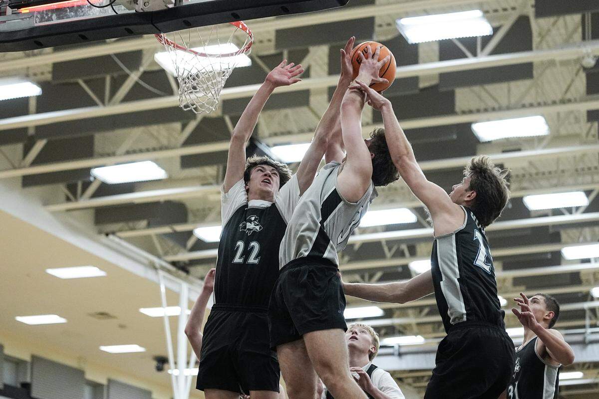 Hough's Beckett Burnette (22) contests a shot from Nolan Iydeka (33) during a boys varsity basketball practice Monday, Nov. 10, 2025, in Cornelius, N.C.