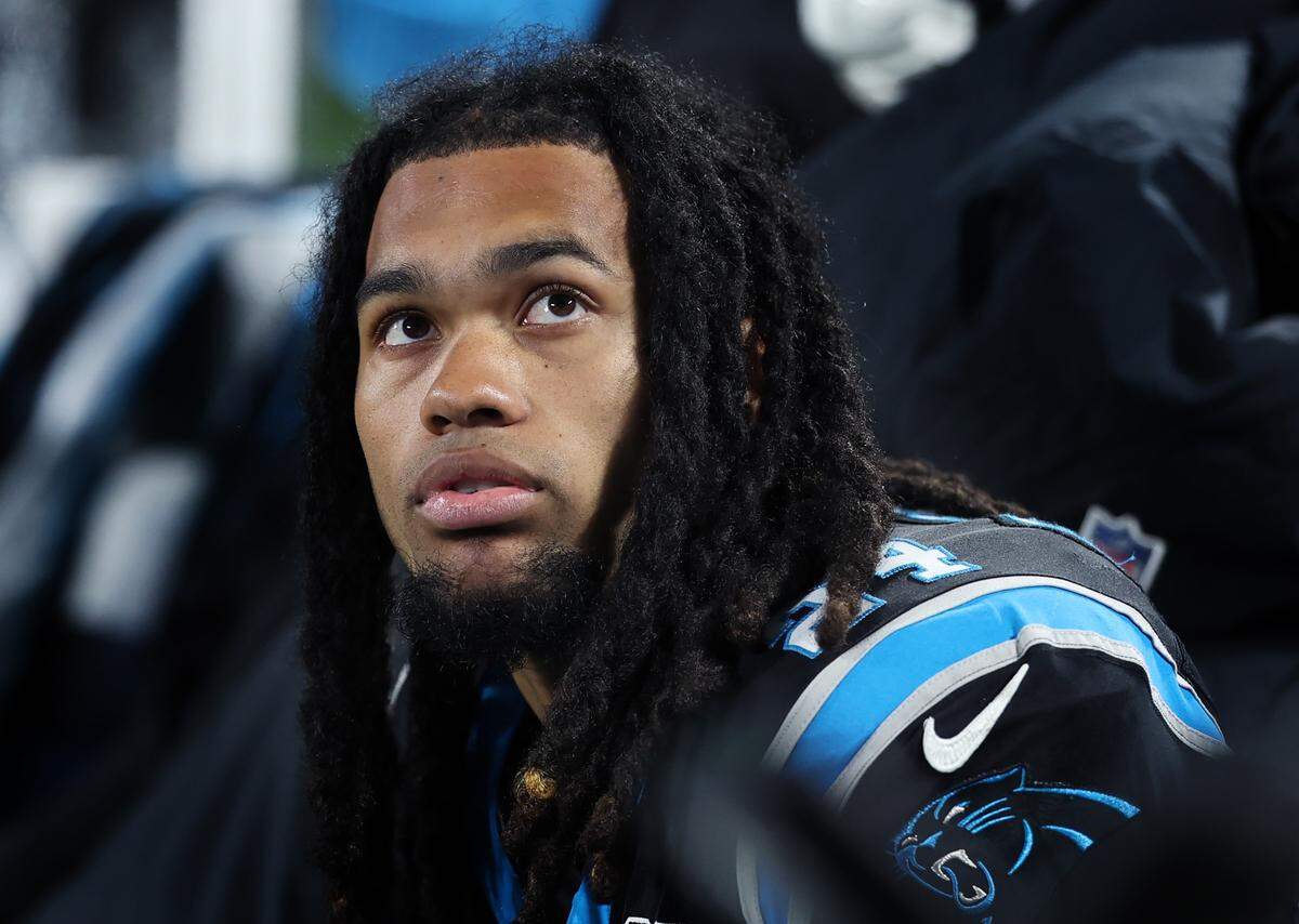 Carolina Panthers running back Jonathon Brooks watches a replay from the team’s sideline during action against the Tampa Bay Buccaneers at Bank of America Stadium in Charlotte, NC on Sunday, December 1, 2024. The Buccaneers defeated the Panthers in overtime 26-23.